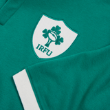 Close-up of the Ireland 25/26 Classic Home Jersey by Canterbury, highlighting the IRFU logo with a white shield, shamrocks, and rugby ball, plus a crisp white cuff.