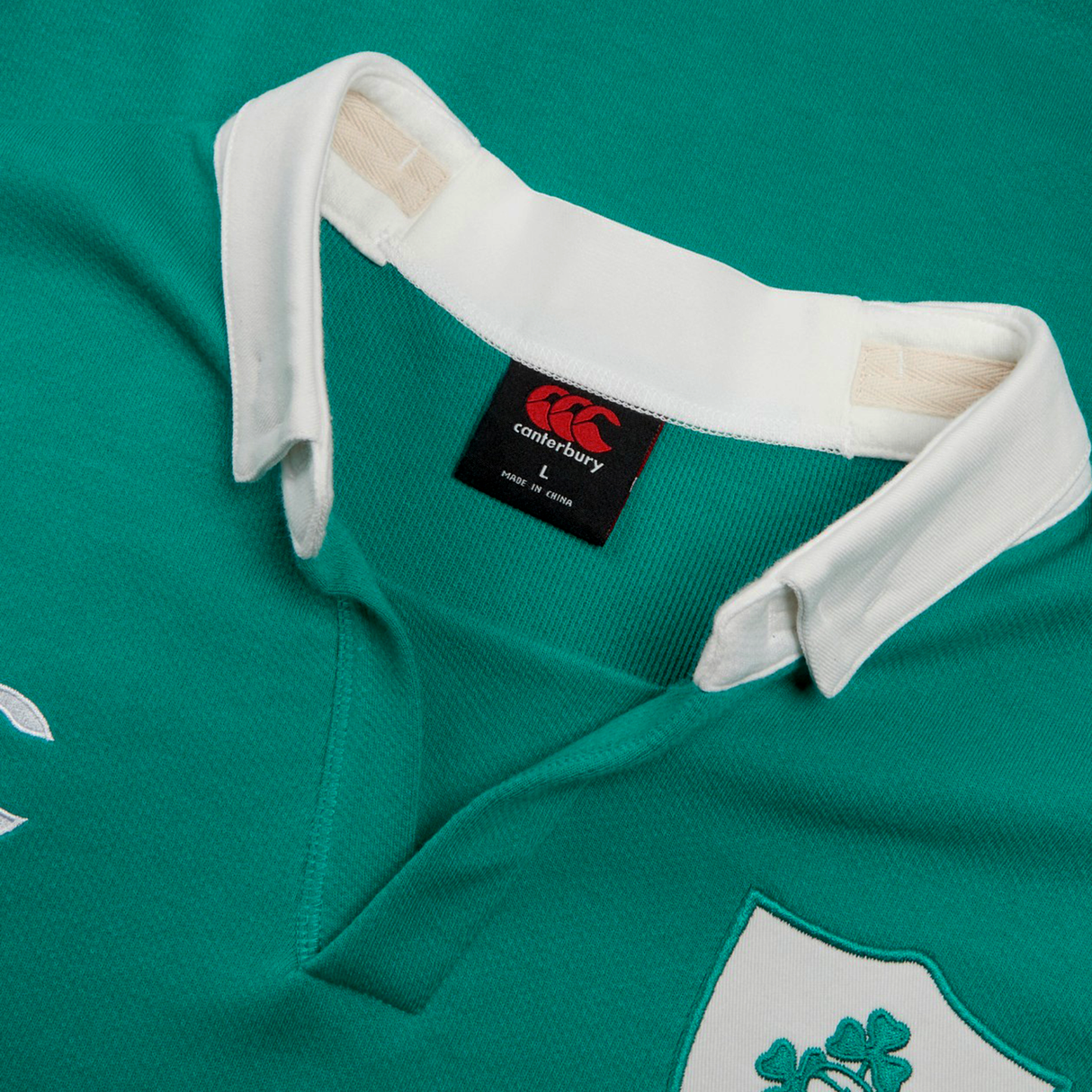 Close-up of the Ireland 25/26 Classic Home Jersey by Canterbury, showcasing a green design with white collar, Canterbury branding, and the Ireland rugby crest on the chest.
