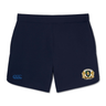 The Old Man Rivah Rugby Women's Elite Woven Short by EMB Canterbury features a navy blue design with a lion crest on the right leg, a blue Canterbury logo on the left leg, and zippered pockets for secure storage during training.