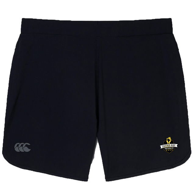 The Chicago Riot Women's Elite Woven Short by EMB Canterbury features a small white logo on the left leg, a yellow and white "Concord Rugby" crest on the right, and convenient zippered pockets for secure storage.