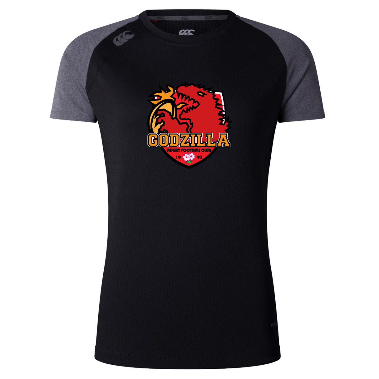 The Godzilla Rugby Football Club Women’s Elite Training Tee by WRS Canterbury features a black short-sleeve design with dark gray sleeves and showcases a “Godzilla Rugby Football Club” logo—a red monster and yellow castle—on the chest. Crafted as a lightweight training shirt for comfort and performance, it’s ideal for active workouts or casual wear.