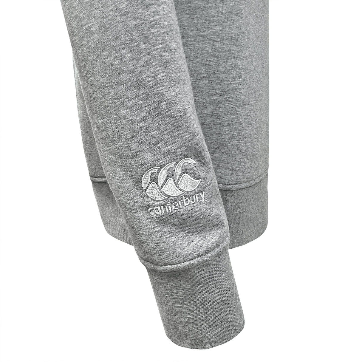 Close-up of grey Canterbury Club Crew Sweatshirt with CCC logo embroidered on the leg.