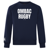 The OMBAC Rugby Club Crew Sweatshirt by WRS Canterbury is an ultra-soft navy blue garment featuring "OMBAC RUGBY Est 1966" printed in white on the chest and an embroidered CCC logo on the left sleeve, offering both style and comfort.