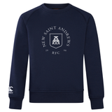 Introducing the New Saint Andrews College Club Crew Sweatshirt by Canterbury. This ultra-soft navy blue crewneck features bold white “New Saint Andrews RFC 1994” text and logo on the chest, along with an authentic embroidered CCC logo on the left sleeve for a signature WRS Canterbury touch—perfect for everyday comfort and style.