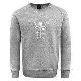 Ultra soft grey Cal Lutheran University Club Crew Sweatshirt by Canterbury featuring a white graphic of a crest with a knight’s helmet, two swords, a cross, and the year 1968.