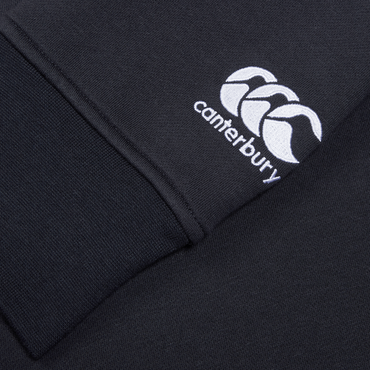 A Canterbury Club Crew Sweatshirt with a logo on it.