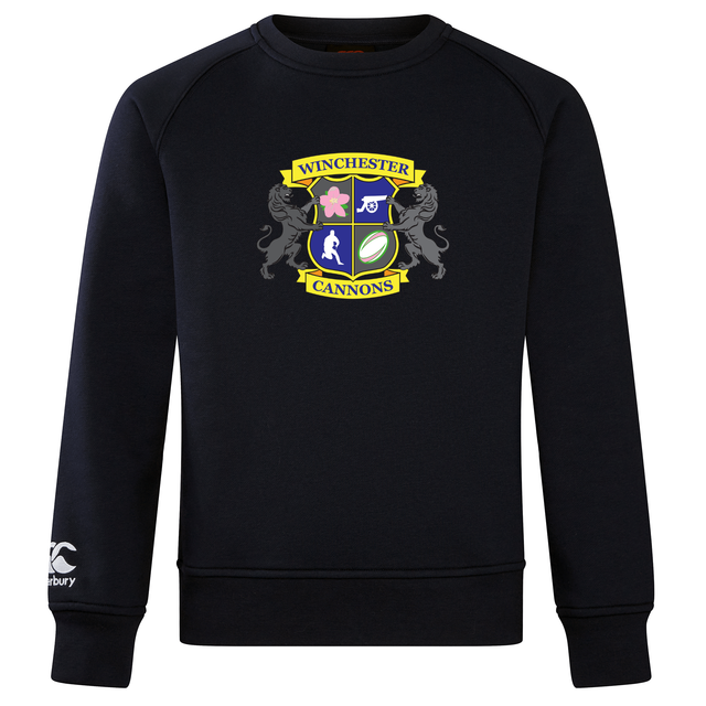 The Winchester Cannons Club Crew Sweatshirt by WRS Canterbury is a navy blue ultra-soft sweatshirt with a multicolored crest on the front and an embroidered CCC logo on the left sleeve, combining comfort and style.