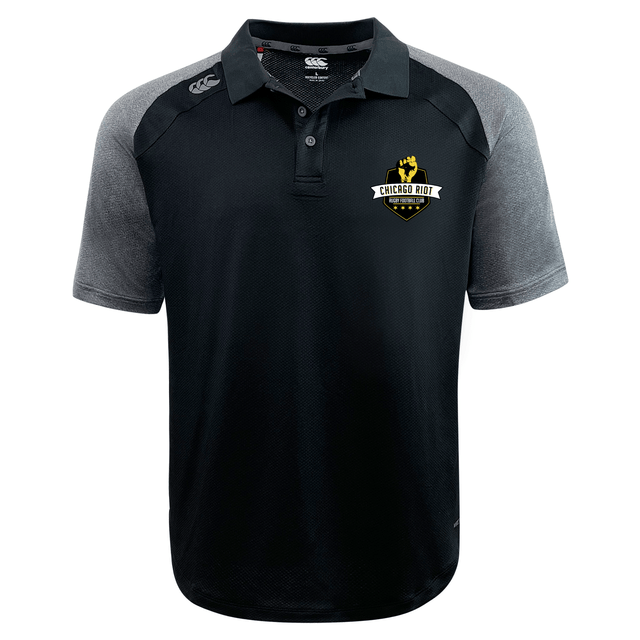 The Chicago Riot Elite Polo by EMB Canterbury features a black and gray design, "Chicago Riot Rugby" left chest logo, and is made from lightweight, durable Vapodri fabric for comfort and performance.
