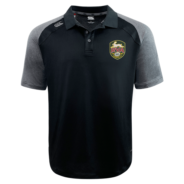 The RVA T.R.C. Elite Polo by Canterbury is a black and gray short-sleeve polo, crafted from lightweight and durable Vapodri fabrics. It features an “RVA” logo patch on the left chest and a small white EMB Canterbury logo on the right shoulder.