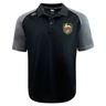 The RVA T.R.C. Elite Polo by Canterbury is a black and gray short-sleeve polo, crafted from lightweight and durable Vapodri fabrics. It features an “RVA” logo patch on the left chest and a small white EMB Canterbury logo on the right shoulder.
