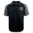 The Winchester Cannons Elite Polo by EMB Canterbury is a black and gray short-sleeve shirt with a crest and ribbon emblem on the left chest, Canterbury logo on the right shoulder, and lightweight Vapodri fabric for comfort.