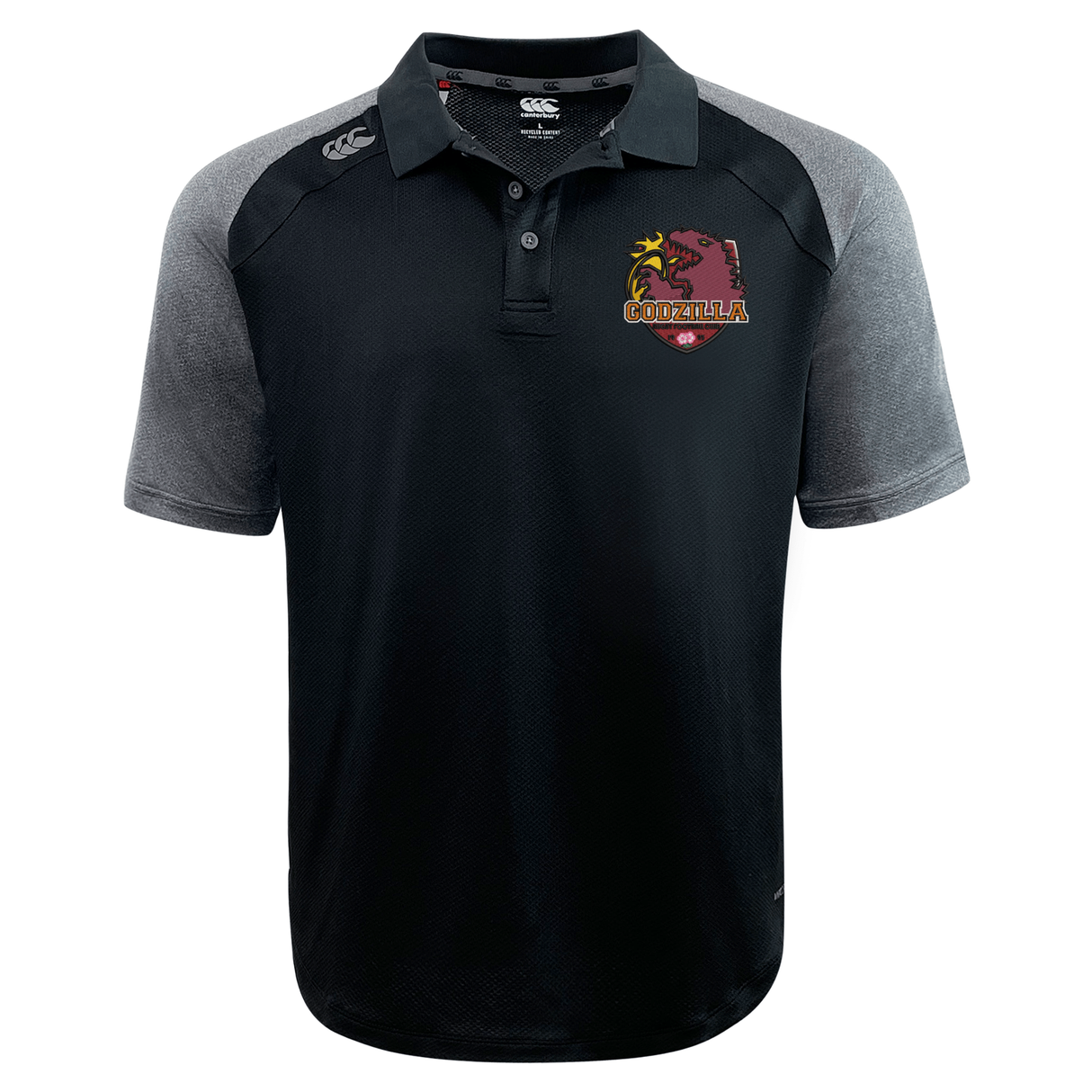 The Godzilla Rugby Football Club Elite Polo by EMB Canterbury features black and gray short sleeves, is crafted with advanced Vapodri moisture-wicking fabric, showcases a “Godzilla” logo and palm tree graphic on the left chest, and is finished with a small brand logo on the right shoulder.