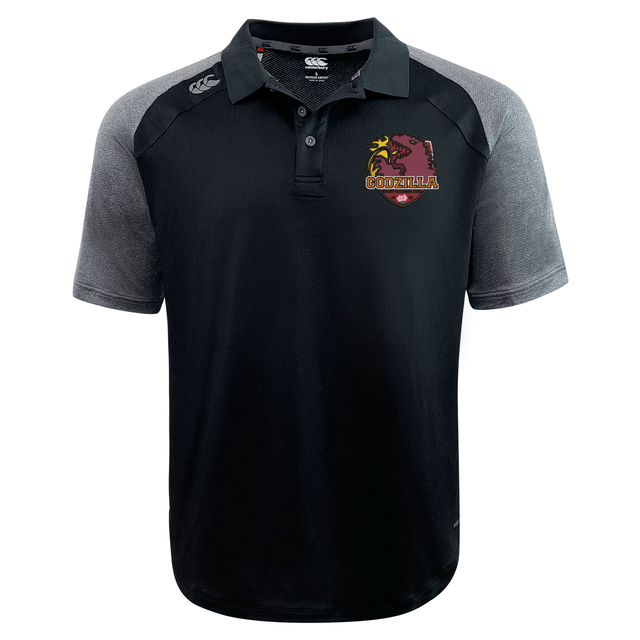 The Godzilla Rugby Football Club Elite Polo by EMB Canterbury features black and gray short sleeves, is crafted with advanced Vapodri moisture-wicking fabric, showcases a “Godzilla” logo and palm tree graphic on the left chest, and is finished with a small brand logo on the right shoulder.