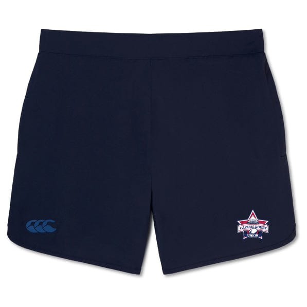 The Capital Selects Elite Woven Short by EMB Canterbury in navy blue showcases a logo on the left leg and a star emblem on the right leg, providing lightweight comfort and convenient zippered pockets.
