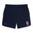 Introducing the Claremont Colleges Elite Woven Short by Canterbury: a pair of navy blue rugby shorts featuring an EMB Canterbury logo on the left leg and a white and red crest on the right leg, perfect for elevating your training experience.