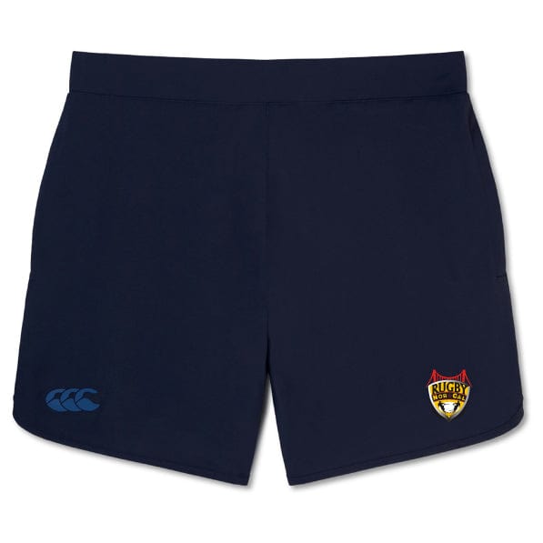 The NorCal Elite Woven Short by EMB Canterbury in navy blue features a team logo on the right leg and a manufacturer's logo on the left, perfect for enhancing your training experience.