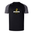 The Chicago Riot Elite Training Tee by Canterbury, from WRS Canterbury, features black and gray colors, a club logo with a yellow fist holding a rugby ball on the chest, and lightweight Vapodri fabric for cool, durable comfort.