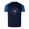 The New Saint Andrews College Elite Training Tee by WRS Canterbury features a navy blue body with blue sleeves and displays “New Saint Andrews RFC 1994” along with a white crest on the chest. Expertly crafted by Canterbury, this tee utilizes innovative Vapodri fabrics to deliver exceptional comfort and performance.