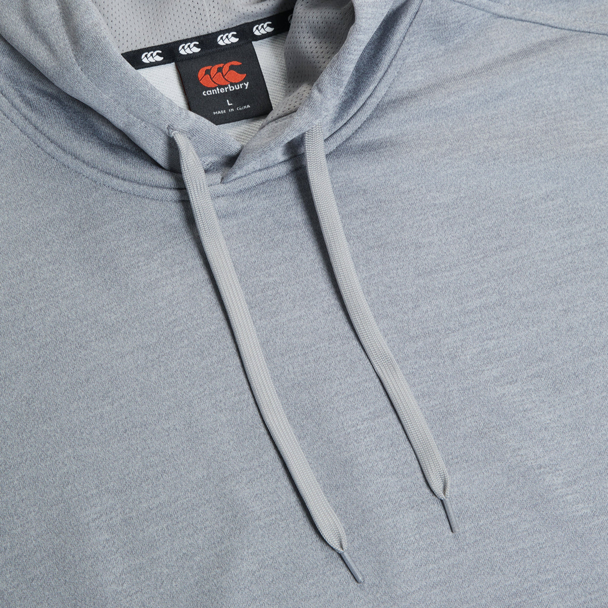 A Canterbury Club Lightweight Hoodie with an orange Canterbury logo on it.