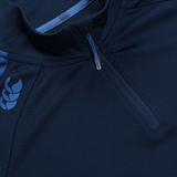 Close-up of a Women's Canterbury Elite First Layer, navy blue athletic top featuring a chest zipper and Canterbury logo, designed with VapoDri technology for enhanced performance, complemented by blue collar accents.
