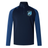 Rewrite: The EMB Canterbury Minneapolis Mayhem Rugby Women’s Elite First Layer by Canterbury is a navy and blue quarter-zip long sleeve athletic jacket, designed specifically for women, featuring advanced VapoDri technology for superior moisture wicking. It showcases a “Minneapolis Mayhem” crest on the left chest and a small Canterbury logo on the right shoulder.