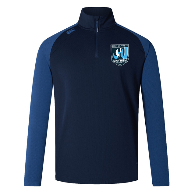 Rewrite: The EMB Canterbury Minneapolis Mayhem Rugby Women’s Elite First Layer by Canterbury is a navy and blue quarter-zip long sleeve athletic jacket, designed specifically for women, featuring advanced VapoDri technology for superior moisture wicking. It showcases a “Minneapolis Mayhem” crest on the left chest and a small Canterbury logo on the right shoulder.