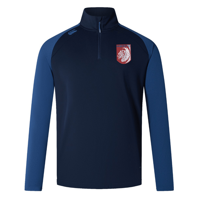 The Montgomery Bucks Griffins Women's Elite First Layer by EMB Canterbury is a navy and blue long-sleeve quarter-zip jacket with a stand collar, lion's head crest, and VapoDri tech for moisture wicking.