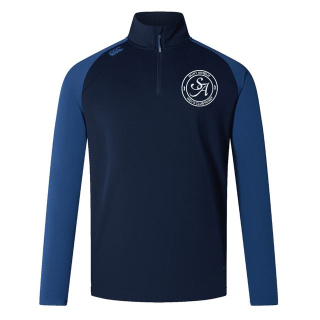 The Saint Anselm College Club Rugby Women's Elite First Layer by EMB Canterbury is a navy and blue long-sleeve pullover with VapoDri tech, Canterbury logo, and club crest—perfect for women's elite training.