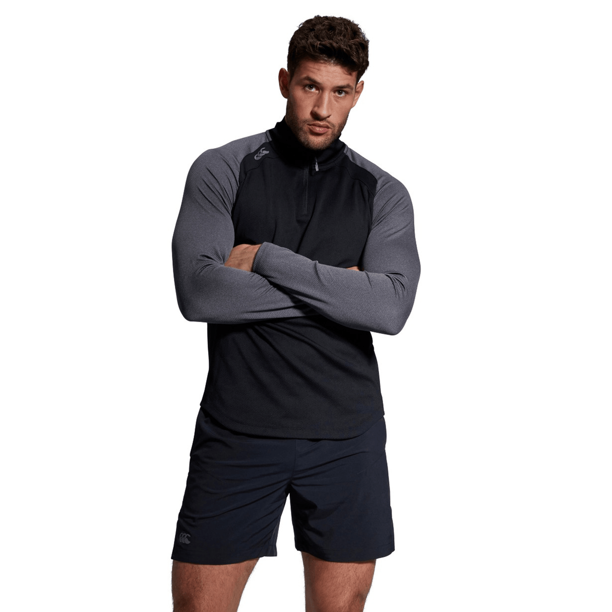 A man is posing for a photo in Canterbury Elite First Layer Canterbury shorts, featuring VapoDri technology.