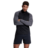 A man is posing for a photo in Canterbury Elite First Layer Canterbury shorts, featuring VapoDri technology.