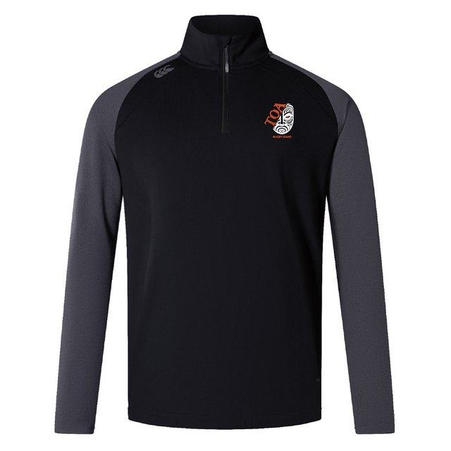 The Toa Rugby Idaho Women's Elite First Layer by EMB Canterbury, features VapoDri tech for comfort. This long-sleeve, black and gray pullover includes a quarter-zip, Canterbury logo near the collar, and a stylized mask emblem on the chest that blends style with performance.