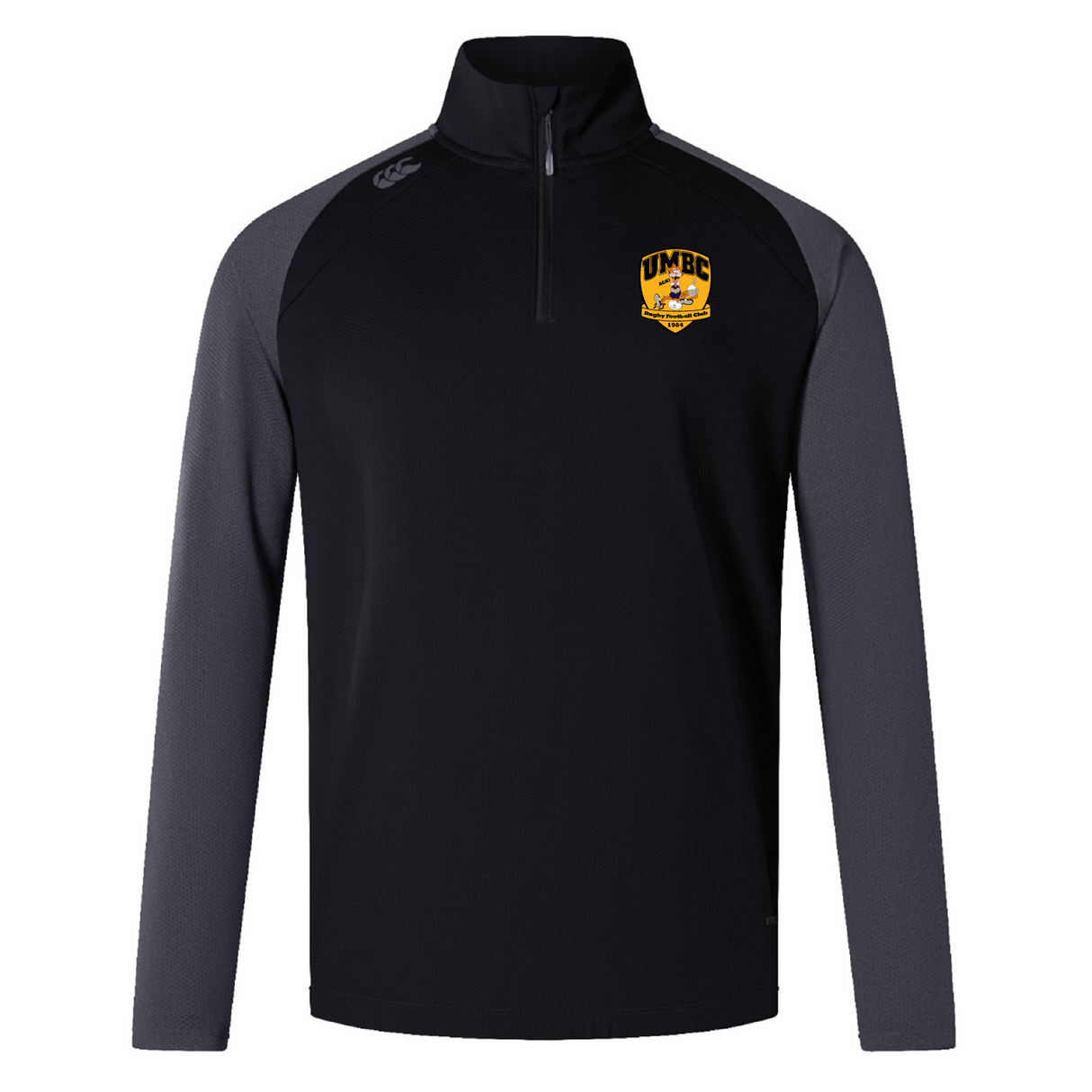 The EMB Canterbury UMBC Rugby Women's Elite First Layer is a black and gray long-sleeve pullover with a half-zip made from honeycomb fabric. It features a UMBC logo on the chest and VapoDri technology for superior moisture-wicking performance.
