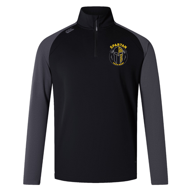 The Spartan Youth Rugby Elite First Layer by EMB Canterbury is a black and dark gray long-sleeve training top with a quarter zip and yellow Spartan logo, designed for comfort and performance.