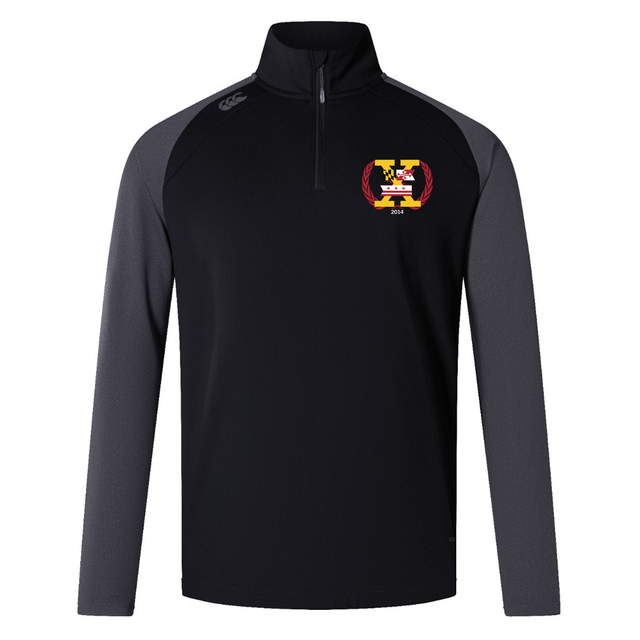 The Potomac Exiles Rugby Club Elite First Layer by Canterbury from EMB Canterbury is a black and dark gray long-sleeve quarter-zip rugby training top, showcasing a vibrant crest on the left chest and a logo on the right shoulder. Engineered as Canterbury's Elite First Layer, it features advanced VapoDri technology for exceptional comfort and moisture management during high-intensity sessions.