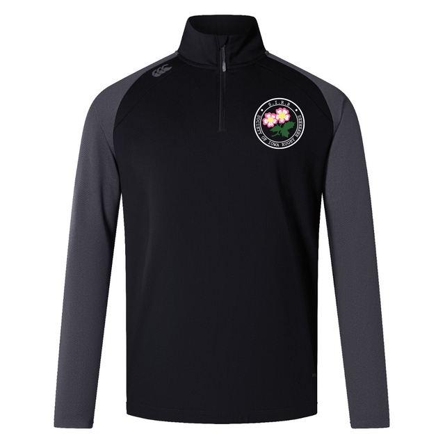 The Society of Iowa Rugby Referees Elite First Layer by Canterbury from EMB Canterbury is a black and dark gray long-sleeve pullover featuring a partial front zipper and a circular floral emblem on the left chest, inspired by the Canterbury Elite First Layer rugby training top and enhanced with VapoDri technology for superior comfort.