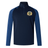 The Old Man Rivah Rugby Elite First Layer by EMB Canterbury is a navy blue long-sleeve quarter-zip training top with VapoDri tech, royal blue sleeves, and a lion-and-shield crest on the left chest.