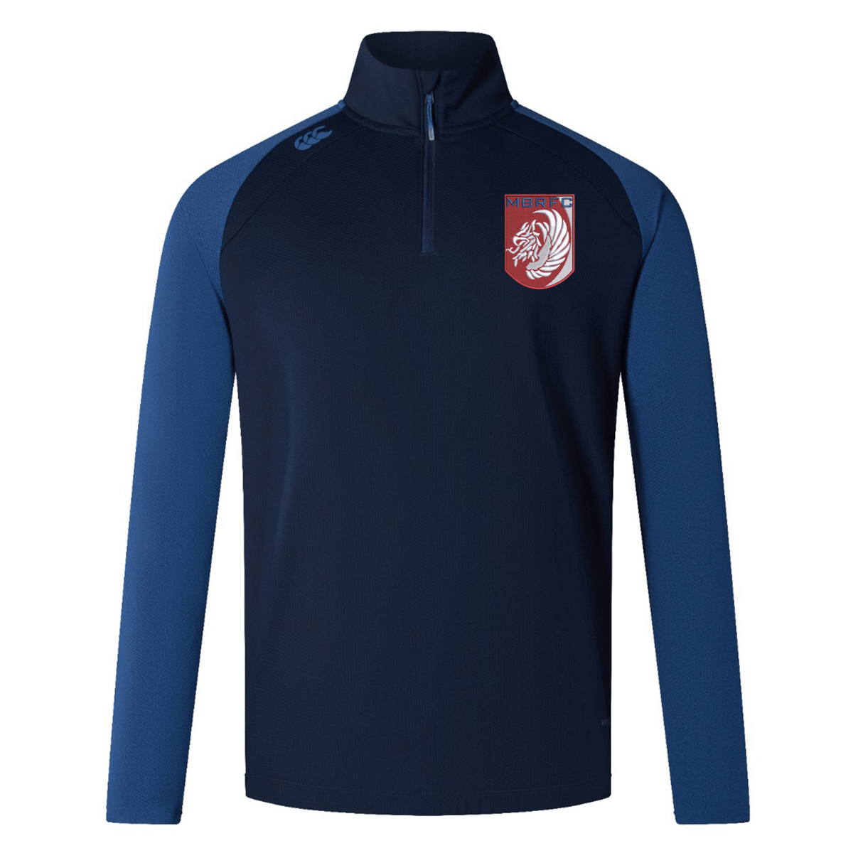 The Montgomery Bucks Griffins Elite First Layer by EMB Canterbury is a navy and blue long-sleeve rugby top with a quarter-zip, white lion crest, "MERIT" on the left chest, VapoDri tech, and a small logo on the right shoulder.