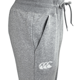 Close-up of the Canterbury Leisure Sweatpant by Canterbury, featuring an elastic waistband, drawstring, side pocket, and a logo of three waves on the upper thigh. Made from a sustainable blend for ultimate comfort in a stylish gray hue.