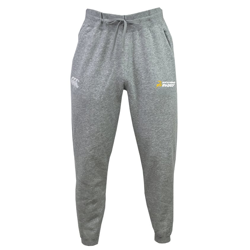 Experience the comfort of Faribault Boksprings Leisure Sweatpants by Canterbury, crafted by EMB Canterbury from organic cotton. These gray sweatpants feature a drawstring waist and are adorned with a subtle logo on the right thigh and an emblem on the left.