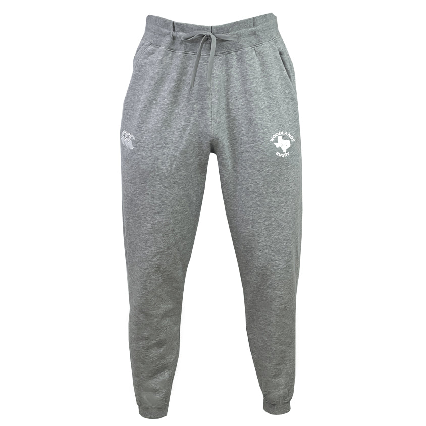 The Woodlands Rugby Leisure Sweatpant by EMB Canterbury features a drawstring waist, elastic cuffs, and logos on both thighs. Made from organic cotton for comfort and sustainability.