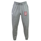 Grey Canterbury Legion Academy Women’s Leisure Sweatpant in organic cotton, featuring a drawstring waist, a logo on the left hip, and a red and white “Legion Academy SD” emblem on the right thigh.