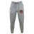 The Godzilla Rugby Football Club Leisure Sweatpant by EMB Canterbury features a gray sustainable design with a drawstring waist, convenient side pockets, a white Canterbury logo on the left leg, and a maroon and gold Eaglehawk emblem on the right thigh.