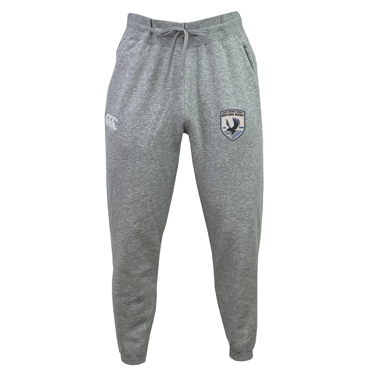 The South Orange County Raptors Leisure Sweatpant by EMB Canterbury is crafted from recycled polyester fleece in gray, featuring a comfortable drawstring waist, an EMB Canterbury logo on the left thigh, and a distinctive Raptors badge on the right thigh, displayed against a plain white background.
