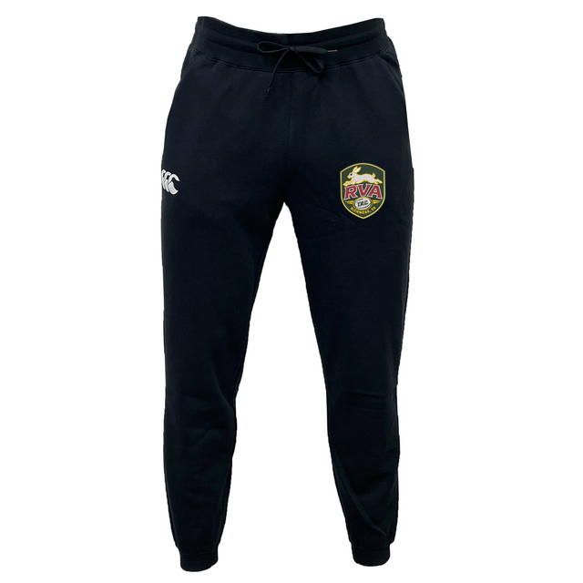The EMB Canterbury RVA T.R.C. Leisure Sweatpant by Canterbury is a pair of black athletic pants with a drawstring waist, made from recycled polyester fleece, showcasing a white EMB Canterbury logo on the left thigh and a multicolored RVA soccer badge on the right thigh, displayed against a white background.