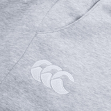 The Women's Leisure Sweatpant by Canterbury features a gray cotton blend fleece fabric with a white embroidered Canterbury logo showcasing three overlapping crescent shapes, ideal for casual wear.