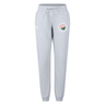 The Society of Iowa Rugby Referees Women’s Leisure Sweatpant by Canterbury from EMB Canterbury offers comfortable, everyday wear with light gray organic cotton fabric, a drawstring waist, and elastic cuffs, featuring a subtle small floral patch design on the left thigh.