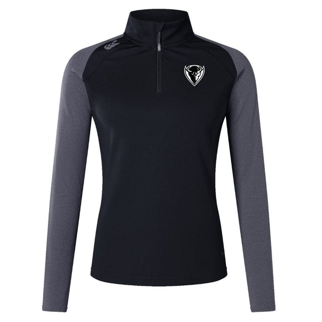 The DePaul University Women's Elite First Layer by Canterbury is a long-sleeve athletic top in black and gray, featuring VapoDri technology, a quarter zip, and a white EMB Canterbury logo on the chest.