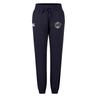 Navy blue ICRON Women’s Leisure Sweatpant by Canterbury featuring a drawstring waist, cuffed ankles, and logos on the upper thighs.
