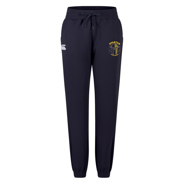 The Spartan Youth Rugby Women's Leisure Sweatpant by EMB Canterbury features navy blue fabric, an elastic waistband with drawstring, a white Canterbury logo on the right thigh, and a yellow and blue emblem on the left thigh—ideal for leisure.
