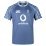 A blue short-sleeve sports training jersey with the IRFU logo and Vodafone sponsorship on the front. The Ireland 24 Training Pro Jersey by Canterbury features shoulders with a pattern resembling lightning.
